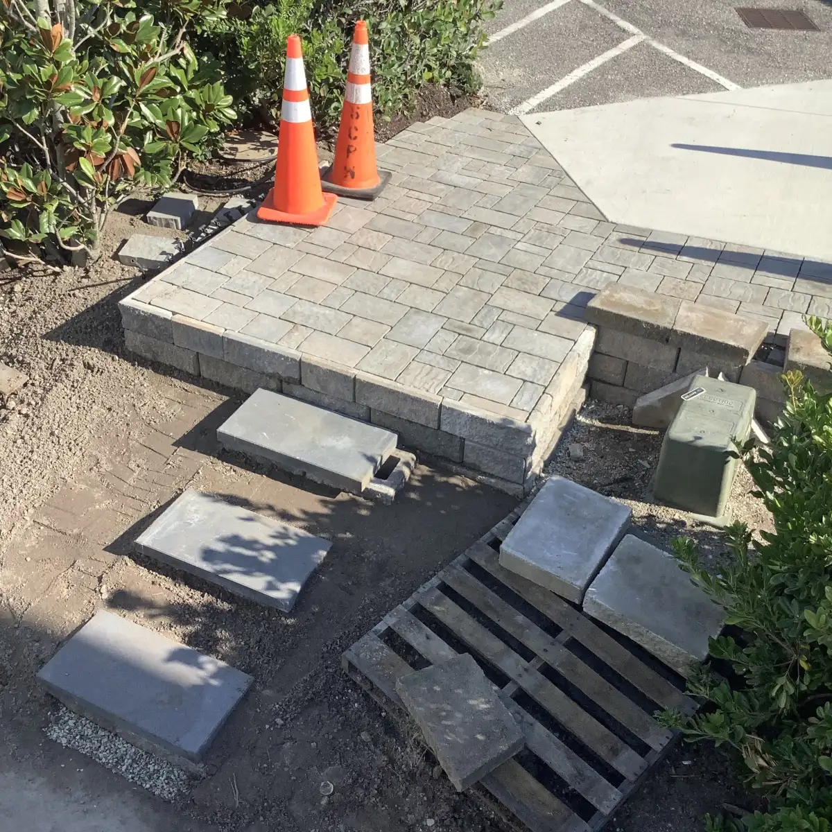 Custom stone fire pit area with paver patio seating in Wilmington NC